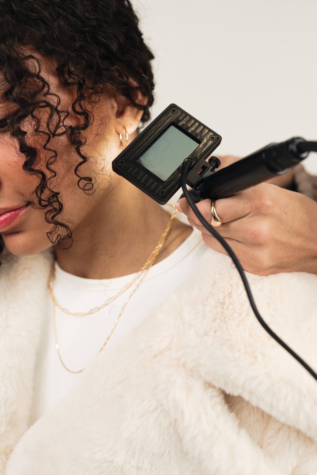 Permanent jewelry welding session at Lash Box Syosset